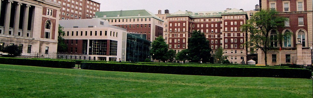 South lawn on campus, green grass. Buildings are Lerner Hall, Butler Library